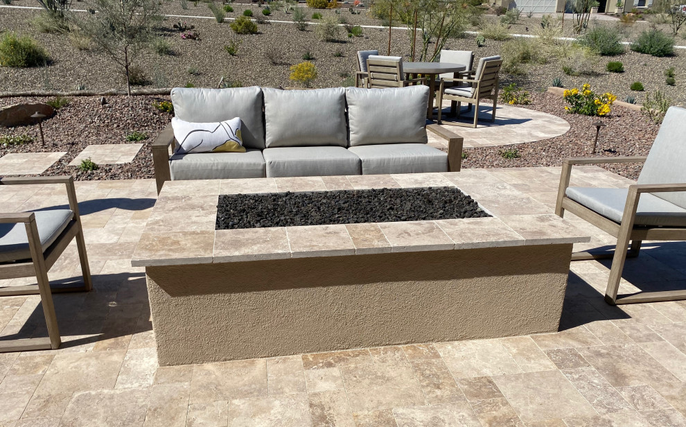 Design ideas for a transitional stone landscaping in Phoenix with a fire pit.