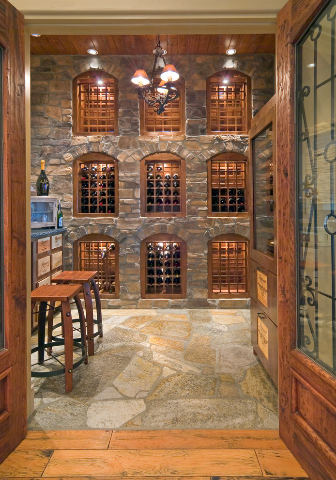 Design ideas for a mediterranean wine cellar in Sacramento with storage racks and multi-coloured floor.
