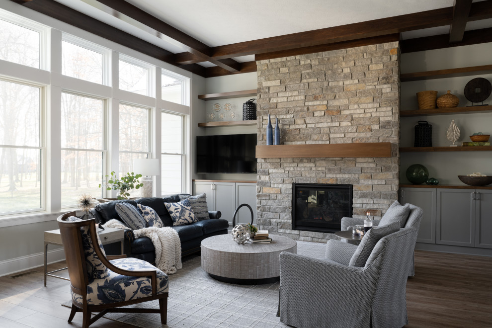 Living room - mid-sized modern formal and enclosed medium tone wood floor living room idea in Indianapolis with beige walls, a standard fireplace, a metal fireplace and a wall-mounted tv