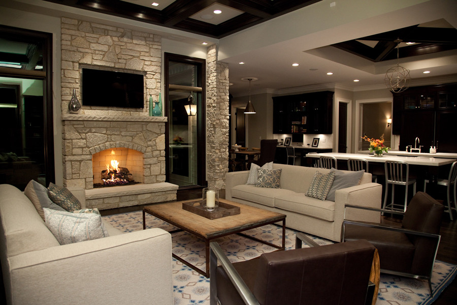 Inspiration for a large traditional formal open concept living room in Chicago with beige walls, dark hardwood floors, a standard fireplace, a stone fireplace surround and a wall-mounted tv.