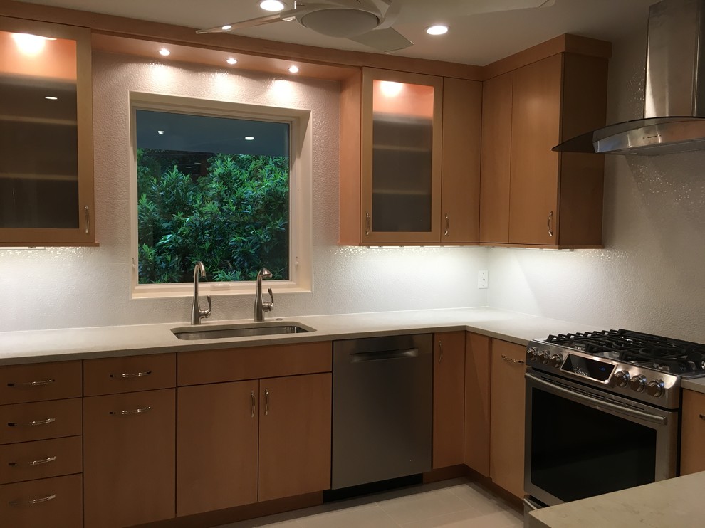 Enclosed kitchen - mid-sized transitional u-shaped porcelain tile and gray floor enclosed kitchen idea in DC Metro with an undermount sink, flat-panel cabinets, medium tone wood cabinets, quartz countertops, white backsplash, porcelain backsplash, stainless steel appliances and no island