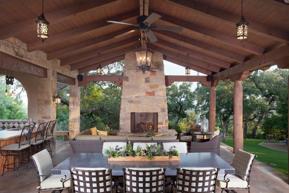 Mid-sized mediterranean one-storey beige exterior in Austin with stone veneer and a gable roof.