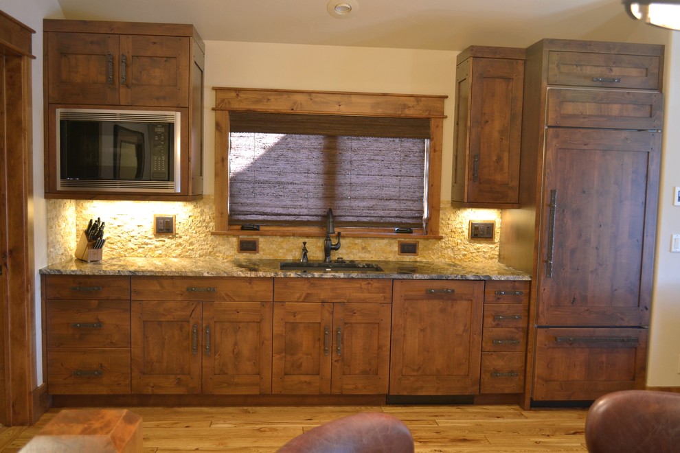 Inspiration for a rustic kitchen in Denver with a submerged sink and integrated appliances.
