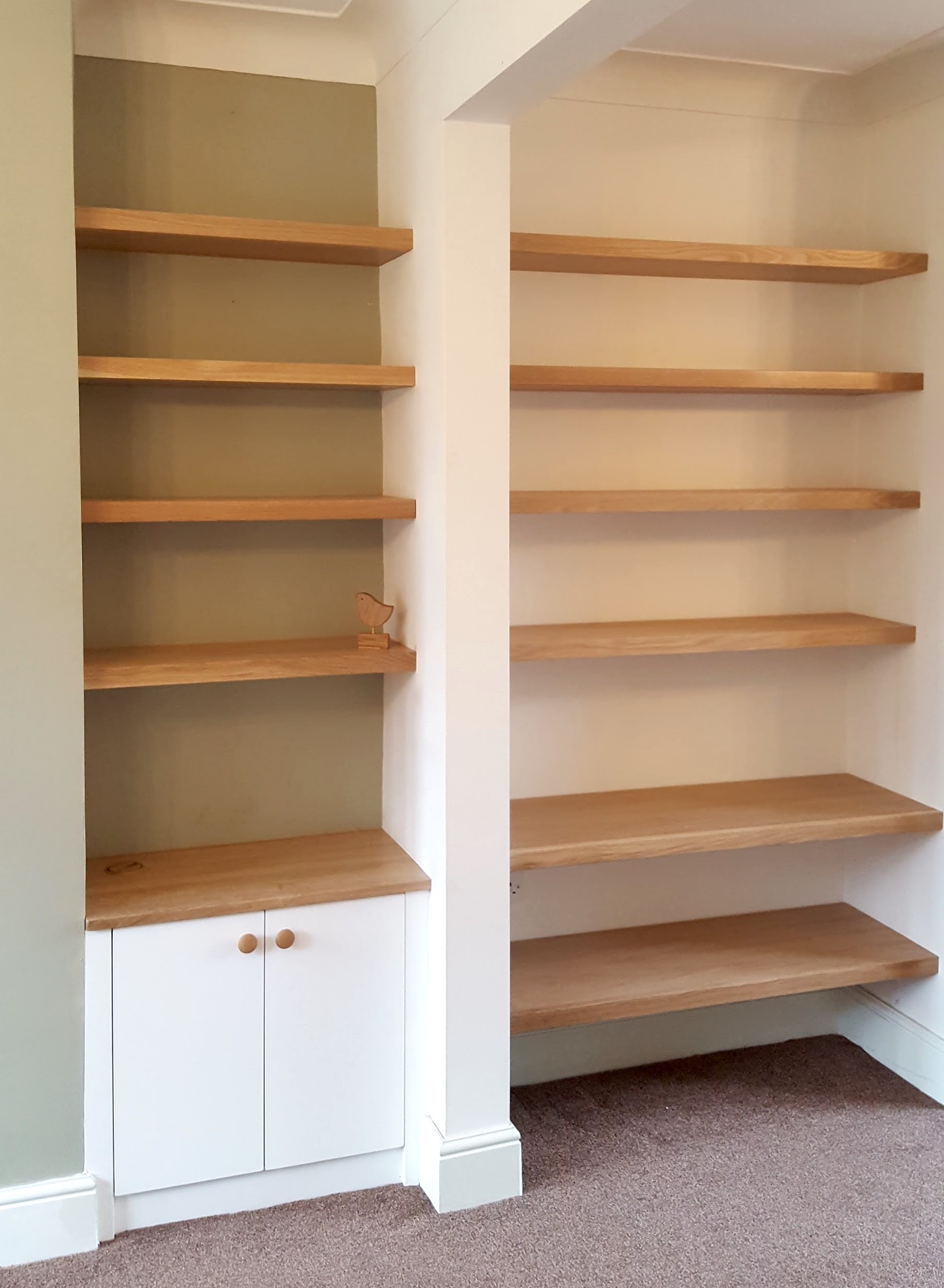 Oak Floating Shelves with white modern slab style door cabinet