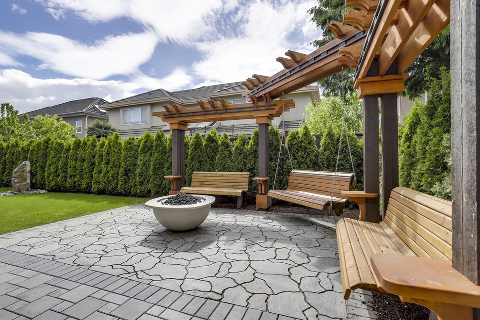 Mid-sized contemporary backyard full sun formal garden in Vancouver with with outdoor playset.