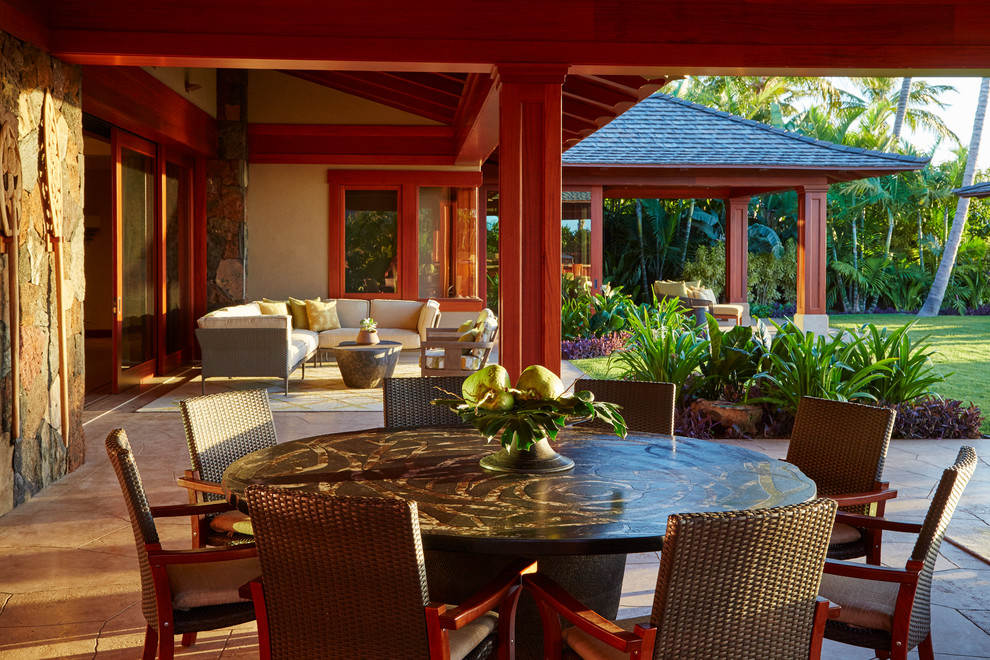 Design ideas for a tropical patio in Hawaii with a roof extension.
