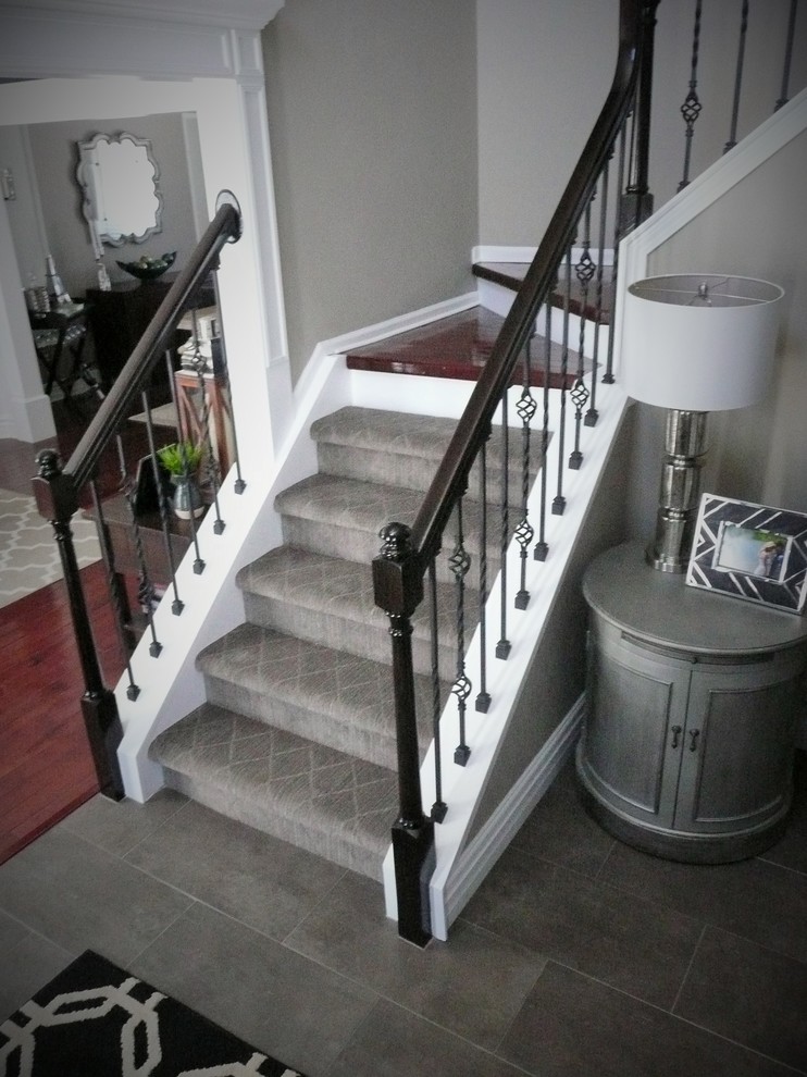 Mid-sized transitional staircase in Detroit.