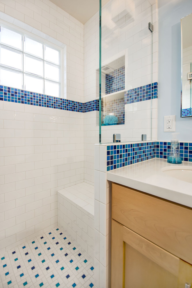Design ideas for a mid-sized traditional 3/4 bathroom in San Francisco with shaker cabinets, brown cabinets, an alcove shower, white tile, porcelain tile, blue walls, porcelain floors, an undermount sink, engineered quartz benchtops, blue floor, a hinged shower door and beige benchtops.