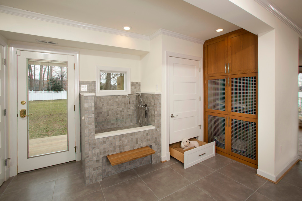 This is an example of a mid-sized transitional l-shaped utility room in DC Metro with beige walls, porcelain floors, shaker cabinets, medium wood cabinets and quartz benchtops.