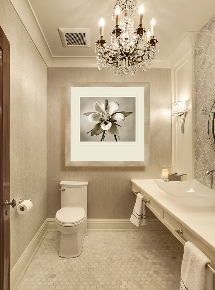 Design ideas for a small transitional powder room in Phoenix with a vessel sink, a one-piece toilet, gray tile, marble floors, beige walls, shaker cabinets, white cabinets and marble.