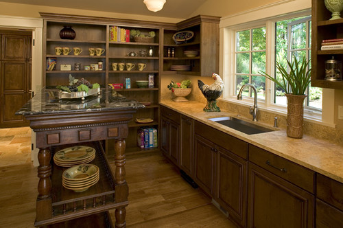 A butler's pantry offers extra storage and clean up space.