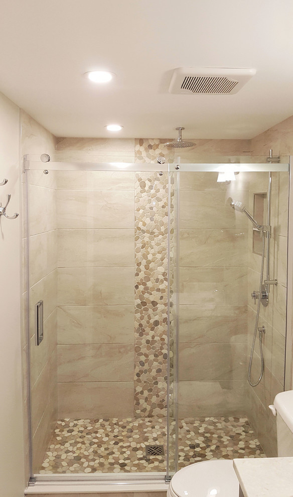 Photo of a mid-sized transitional master bathroom in Other with an alcove shower, beige tile, porcelain tile, beige walls, porcelain floors, beige floor and a sliding shower screen.
