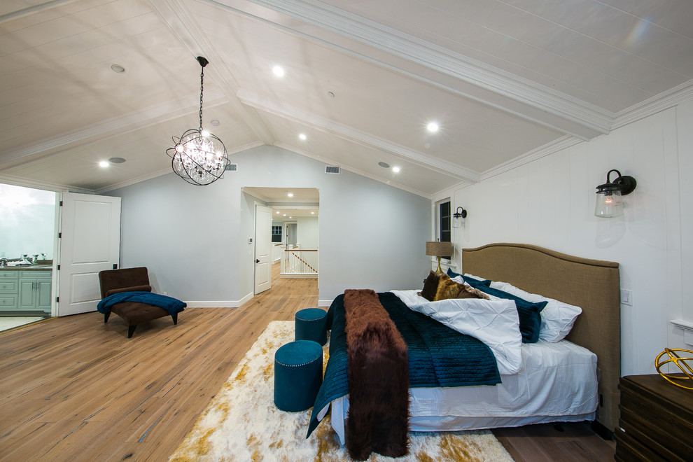 Large transitional master bedroom in Los Angeles with white walls, medium hardwood floors, brown floor and no fireplace.