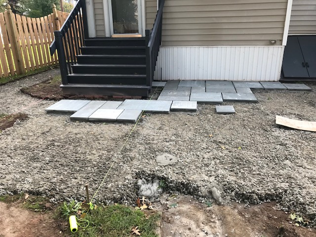 Bluestone patio wet lay with walkway and landscape