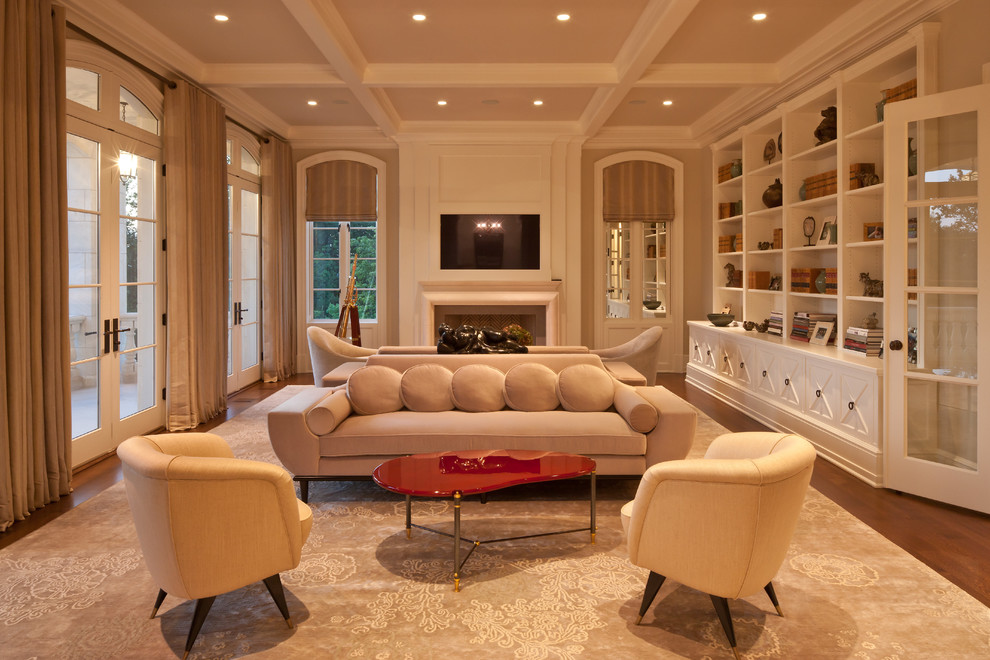 Photo of an expansive traditional living room in New York with beige walls, a standard fireplace and a built-in media wall.