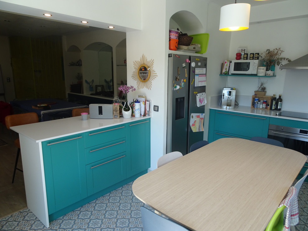 Inspiration for a large traditional l-shaped kitchen in Marseille with an undermount sink, recessed-panel cabinets, turquoise cabinets, quartzite benchtops, white splashback, stainless steel appliances, cement tiles, no island, blue floor and white benchtop.
