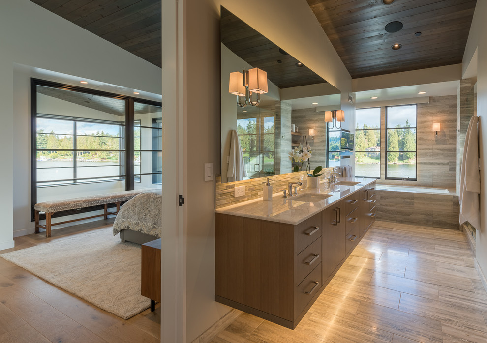 Photo of a large contemporary master bathroom in Seattle with flat-panel cabinets, brown cabinets, an undermount tub, an open shower, a one-piece toilet, white tile, porcelain tile, white walls, porcelain floors, an undermount sink, granite benchtops, beige floor, an open shower and beige benchtops.