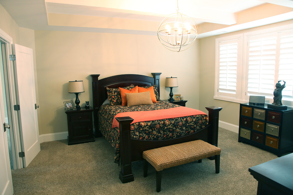 Inspiration for a mid-sized traditional master bedroom in Salt Lake City with beige walls, carpet and no fireplace.
