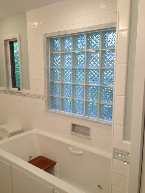 Drop-in bathtub - mid-sized transitional 3/4 blue tile, gray tile, white tile and subway tile gray floor drop-in bathtub idea in Chicago with furniture-like cabinets, white cabinets, white walls, an integrated sink and glass countertops