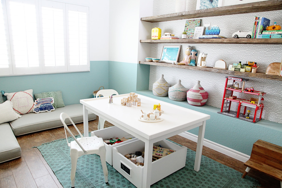 Design ideas for a mid-sized beach style gender-neutral kids' room in Los Angeles with multi-coloured walls, brown floor and dark hardwood floors.