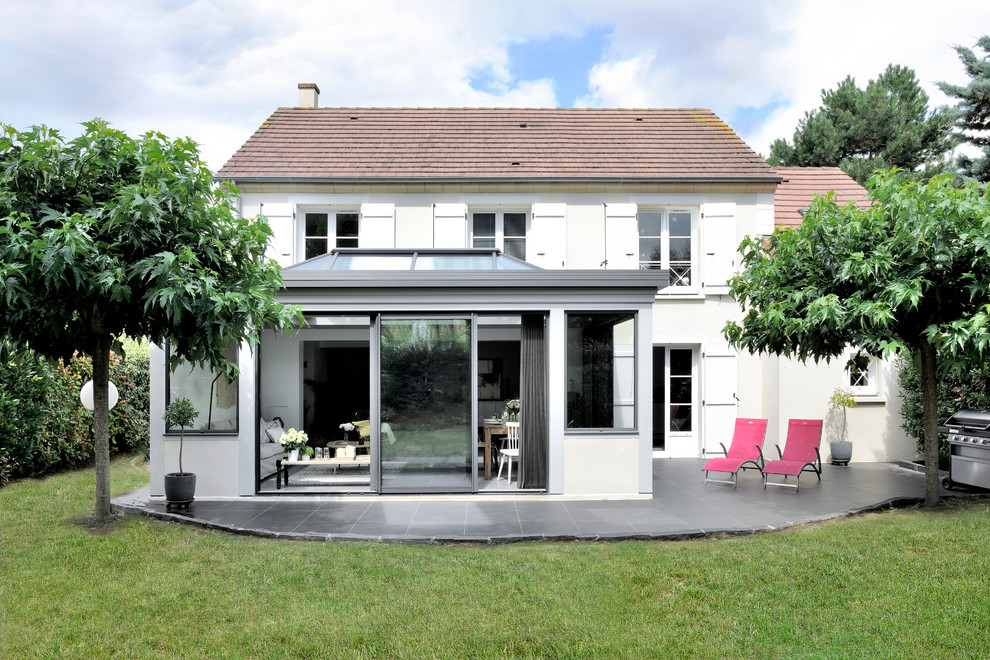 Une Salle A Manger Moderne Dans Une Veranda Toiture Plate Transitional Lyon By Vie Veranda Houzz toiture plate transitional lyon