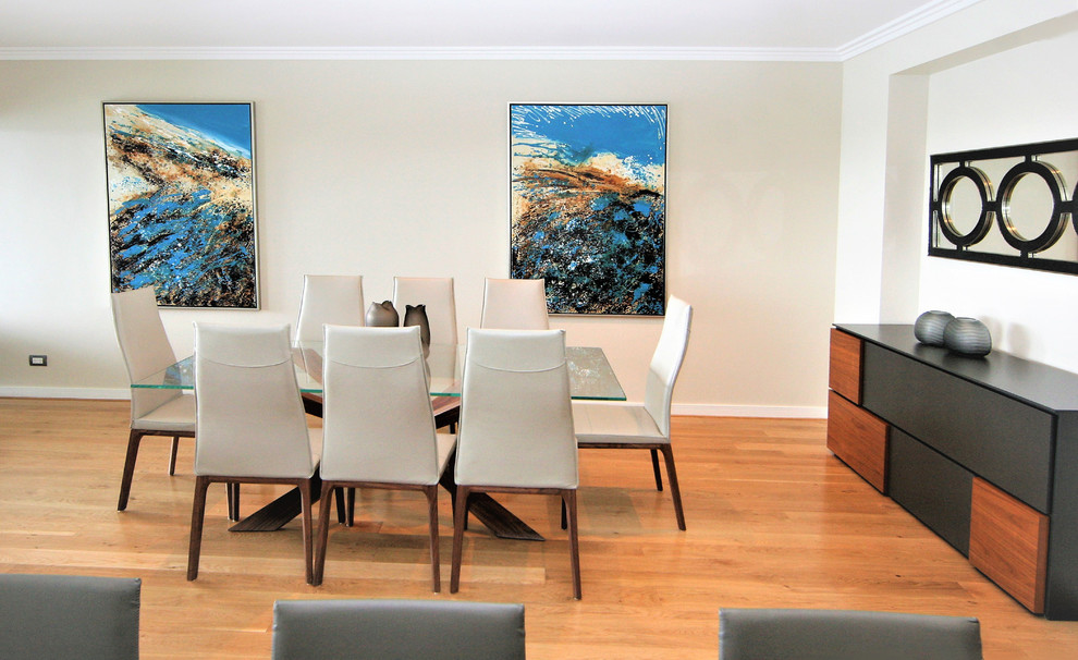 This is an example of a large modern open plan dining in Perth with white walls, light hardwood floors and yellow floor.