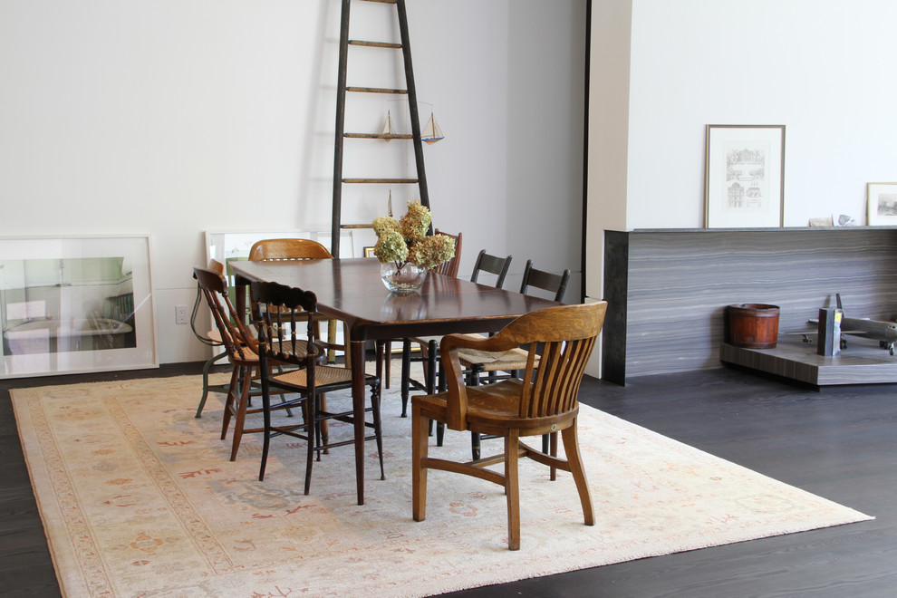 Eclectic dining room in Toronto with white walls and dark hardwood floors.