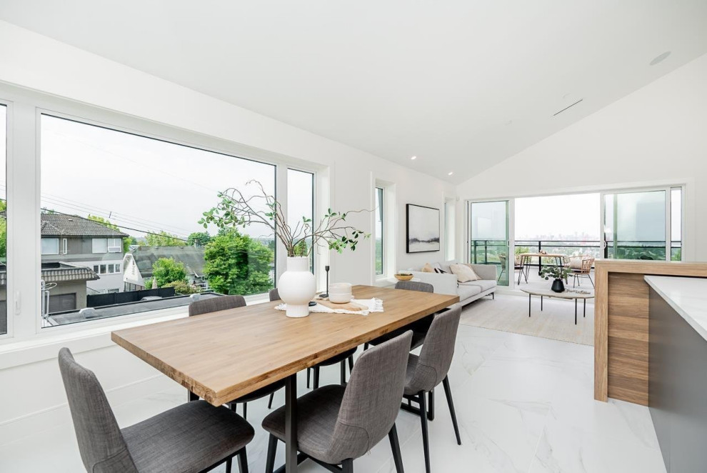 Inspiration for a mid-sized transitional ceramic tile, white floor and vaulted ceiling great room remodel in Vancouver with white walls and no fireplace