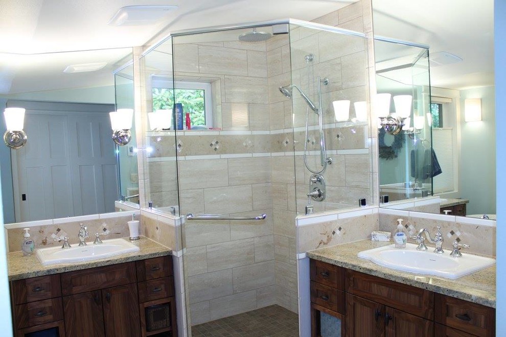 Inspiration for a mid-sized transitional master beige tile and porcelain tile travertine floor and beige floor freestanding bathtub remodel with furniture-like cabinets, dark wood cabinets, blue walls, a drop-in sink and granite countertops