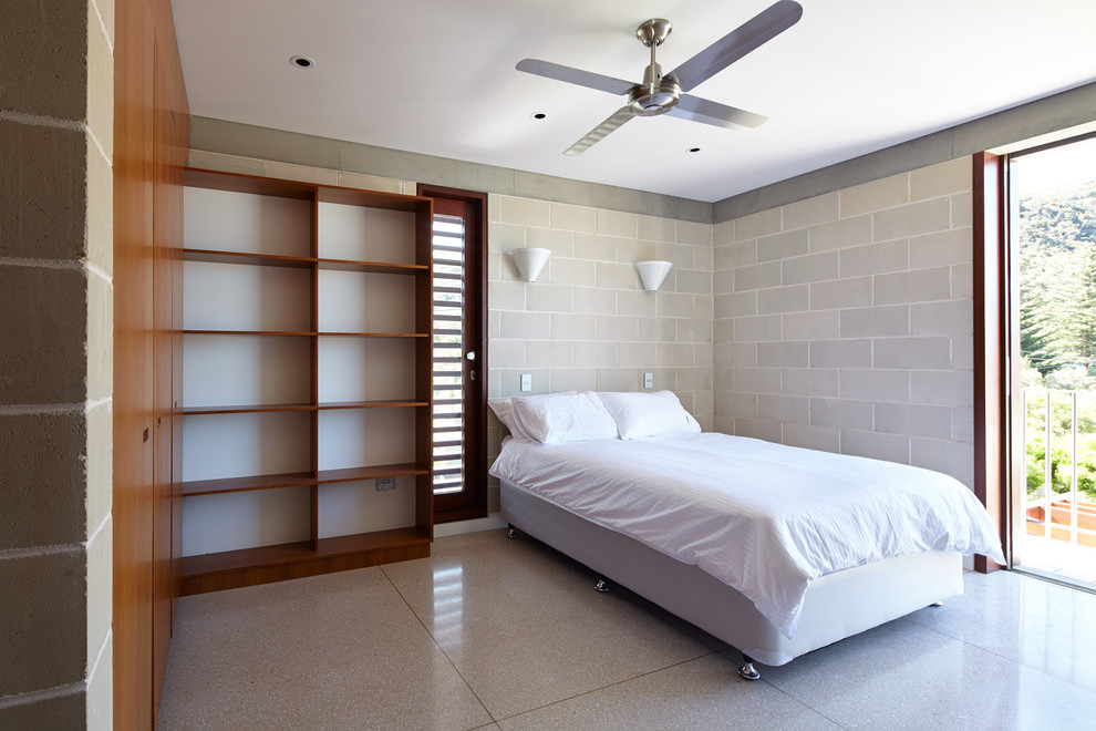 This is an example of a contemporary guest bedroom in Sydney with beige walls.