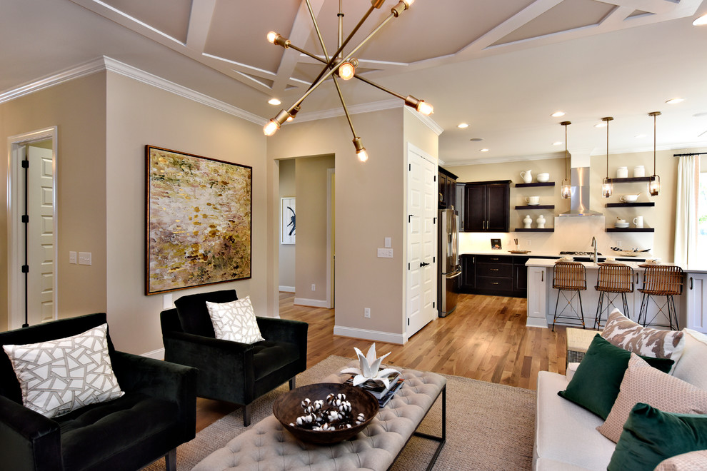 Transitional open concept living room in DC Metro with beige walls and medium hardwood floors.