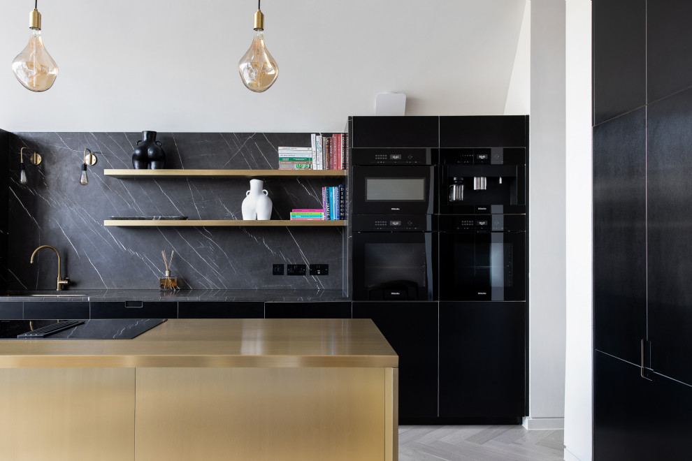 Inspiration for a large contemporary eat-in kitchen in London with an undermount sink, flat-panel cabinets, black cabinets, solid surface benchtops, black splashback, engineered quartz splashback, black appliances, medium hardwood floors, with island, beige floor and black benchtop.