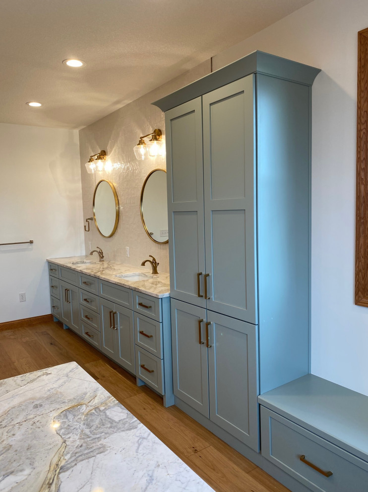 Huge transitional master light wood floor, brown floor and double-sink bathroom photo with shaker cabinets, green cabinets, marble countertops and a built-in vanity
