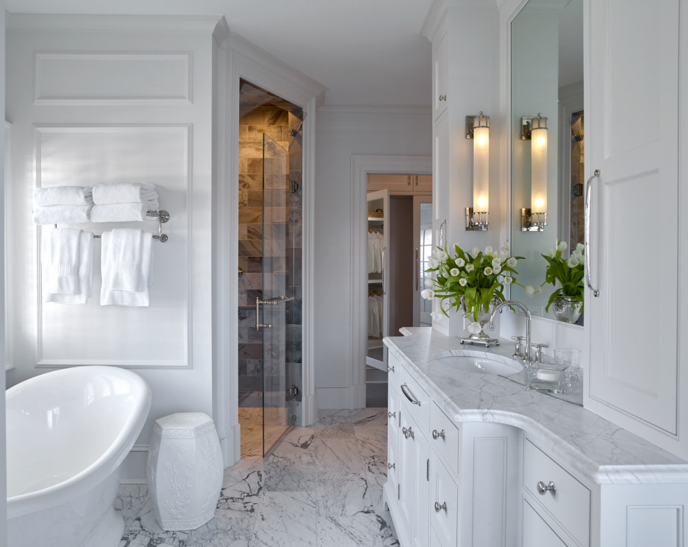 Design ideas for a large traditional master bathroom in Other with beaded inset cabinets, white cabinets, a freestanding tub, an alcove shower, a two-piece toilet, marble floors, an undermount sink, marble benchtops, white floor, white benchtops, a single vanity and a freestanding vanity.