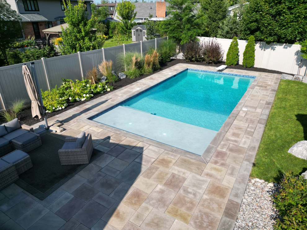 Example of a backyard pool landscaping design in Ottawa