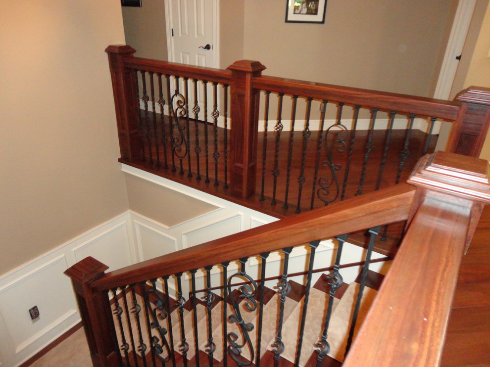 Photo of a mid-sized traditional u-shaped staircase in St Louis.
