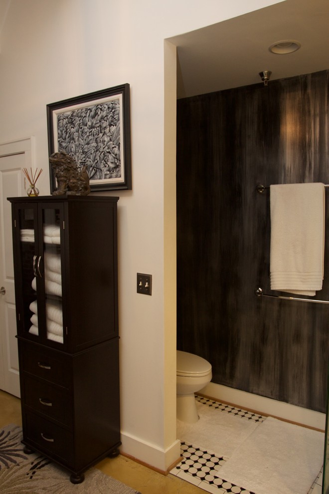 This is an example of a small traditional master bathroom in Other with a freestanding tub, a corner shower, black and white tile, ceramic tile, multi-coloured walls, concrete floors, a console sink, beige floor, a hinged shower door and a two-piece toilet.
