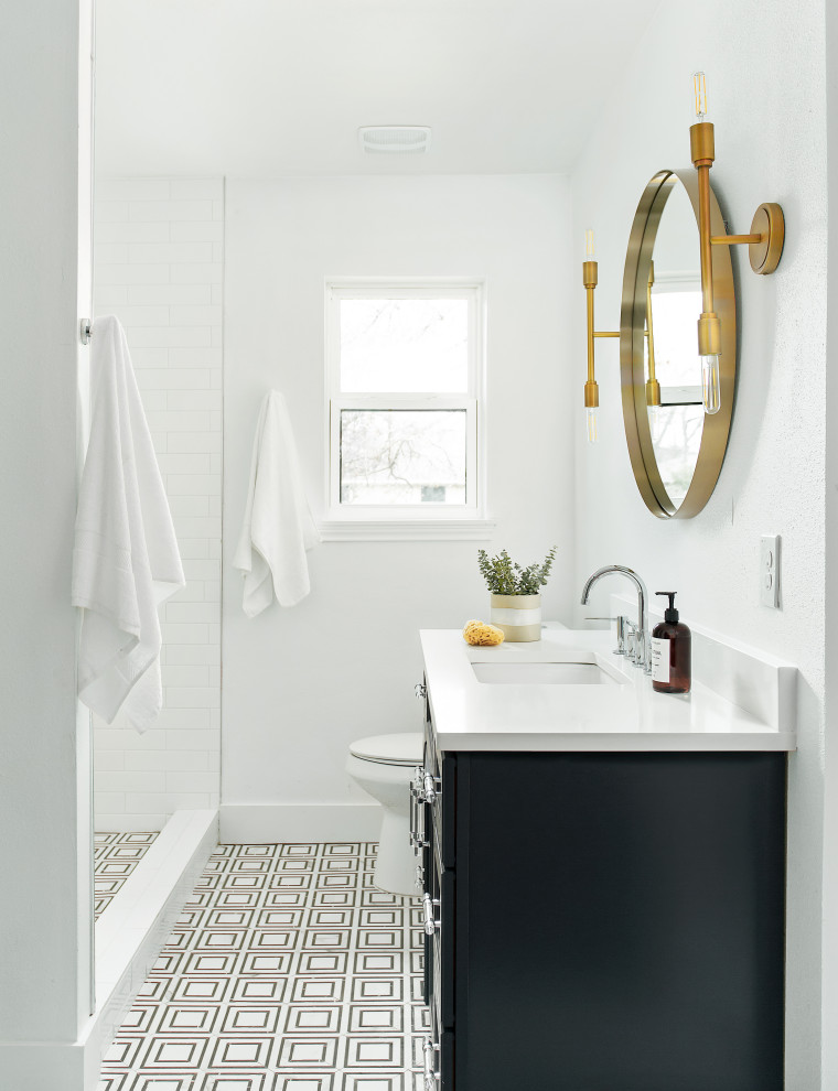 Inspiration for a mid-sized transitional master bathroom in Dallas with shaker cabinets, blue cabinets, white tile, ceramic tile, marble floors, an undermount sink, engineered quartz benchtops and white benchtops.