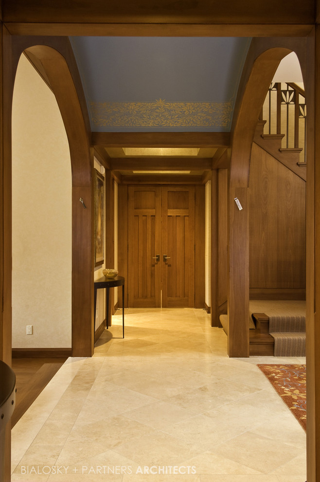 Design ideas for a large arts and crafts hallway in Cleveland with beige walls and porcelain floors.