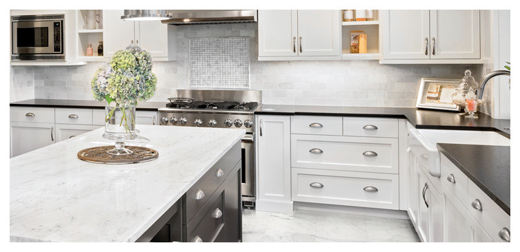 Large transitional u-shaped marble floor and white floor eat-in kitchen photo in Boston with a farmhouse sink, shaker cabinets, white cabinets, marble countertops, white backsplash, subway tile backsplash, stainless steel appliances and an island