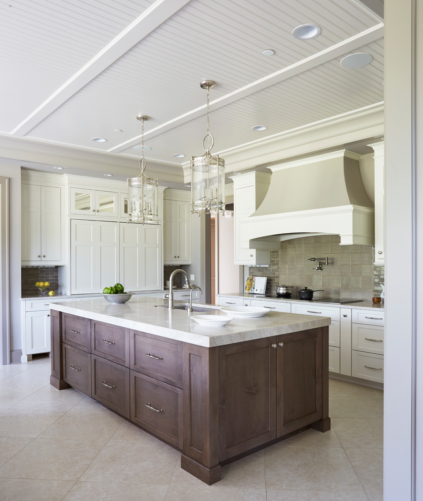 Eat-in kitchen - large transitional u-shaped ceramic tile and gray floor eat-in kitchen idea with a double-bowl sink, raised-panel cabinets, white cabinets, marble countertops, beige backsplash, ceramic backsplash, stainless steel appliances and two islands