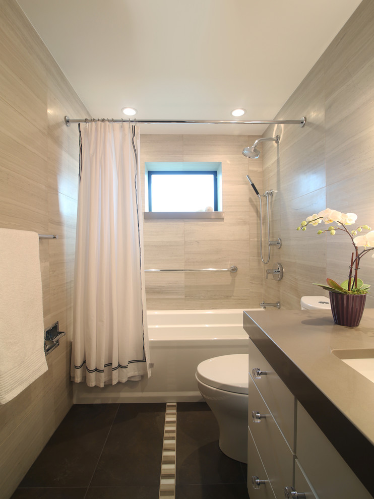 This is an example of a transitional bathroom in Other with an undermount sink, flat-panel cabinets, beige cabinets, an alcove tub, a shower/bathtub combo and beige tile.