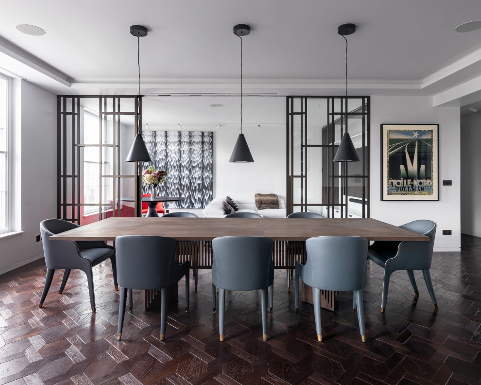 Photo of a contemporary dining room in London with white walls, dark hardwood flooring and brown floors.