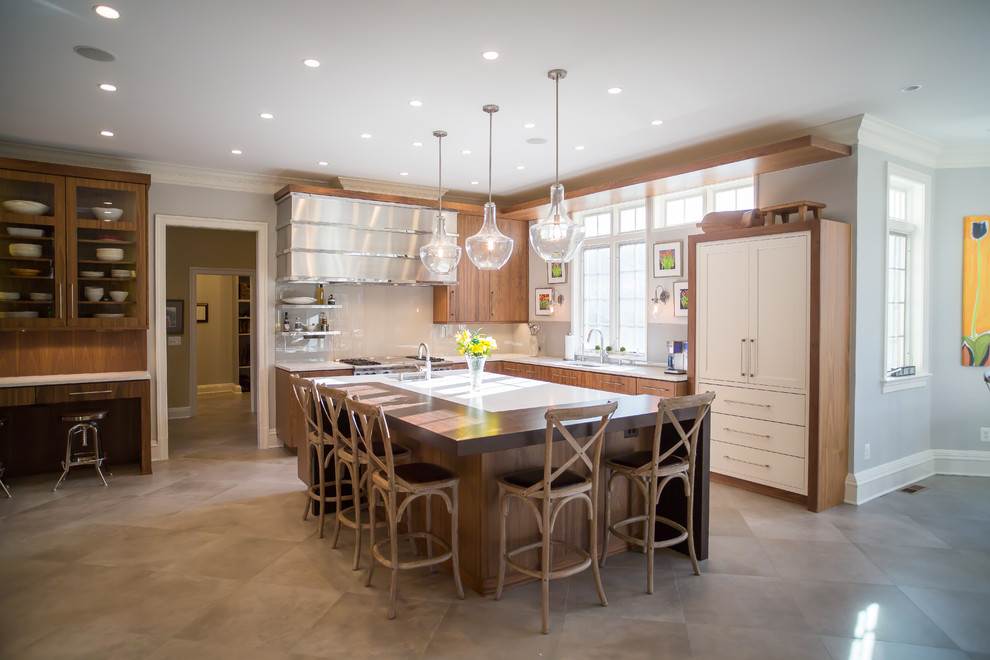 Large transitional l-shaped beige floor open concept kitchen photo in DC Metro with an undermount sink, flat-panel cabinets, medium tone wood cabinets, beige backsplash, stainless steel appliances and an island