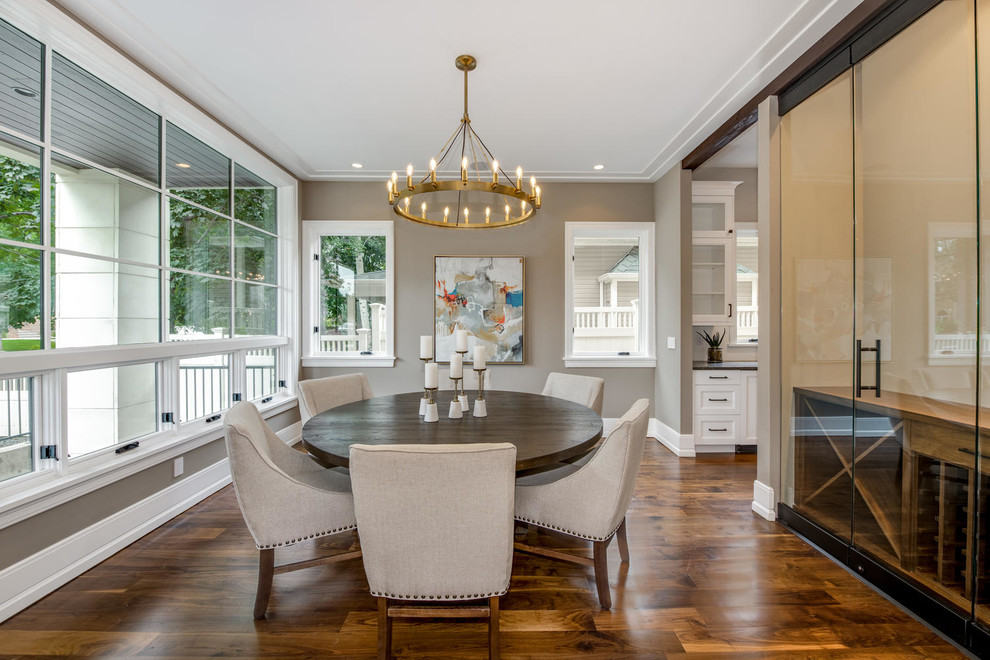 Example of a transitional dining room design in Denver