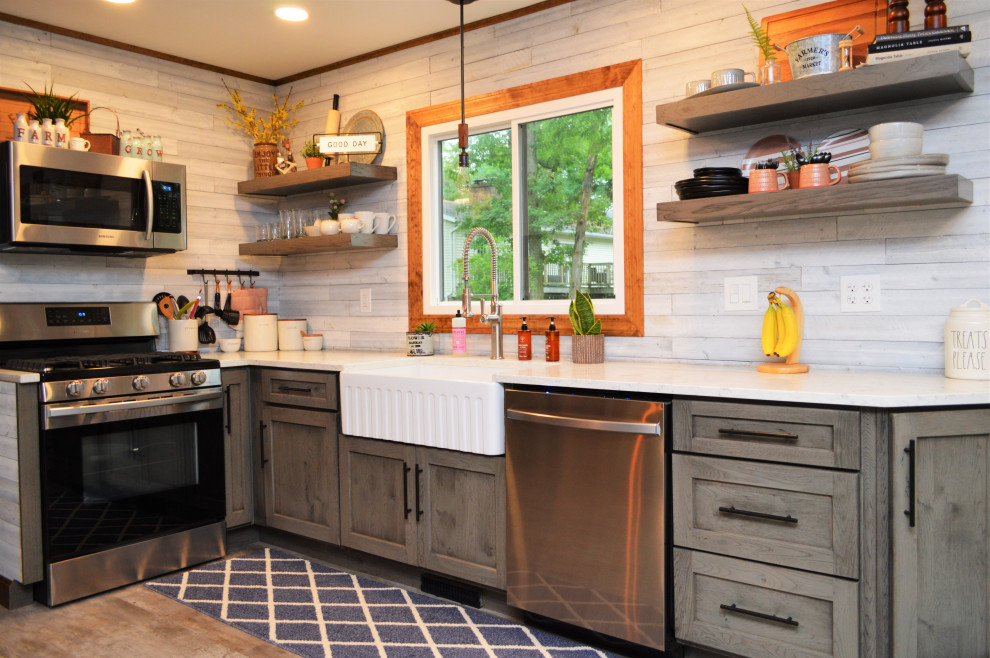 Eat-in kitchen - large modern galley light wood floor and brown floor eat-in kitchen idea in Chicago with a farmhouse sink, shaker cabinets, distressed cabinets, quartz countertops, white backsplash, shiplap backsplash, stainless steel appliances, no island and white countertops