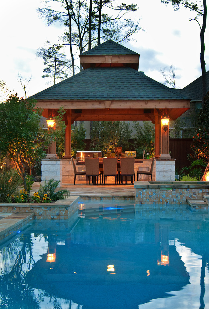 Inspiration for a traditional patio in Houston with an outdoor kitchen and a gazebo/cabana.