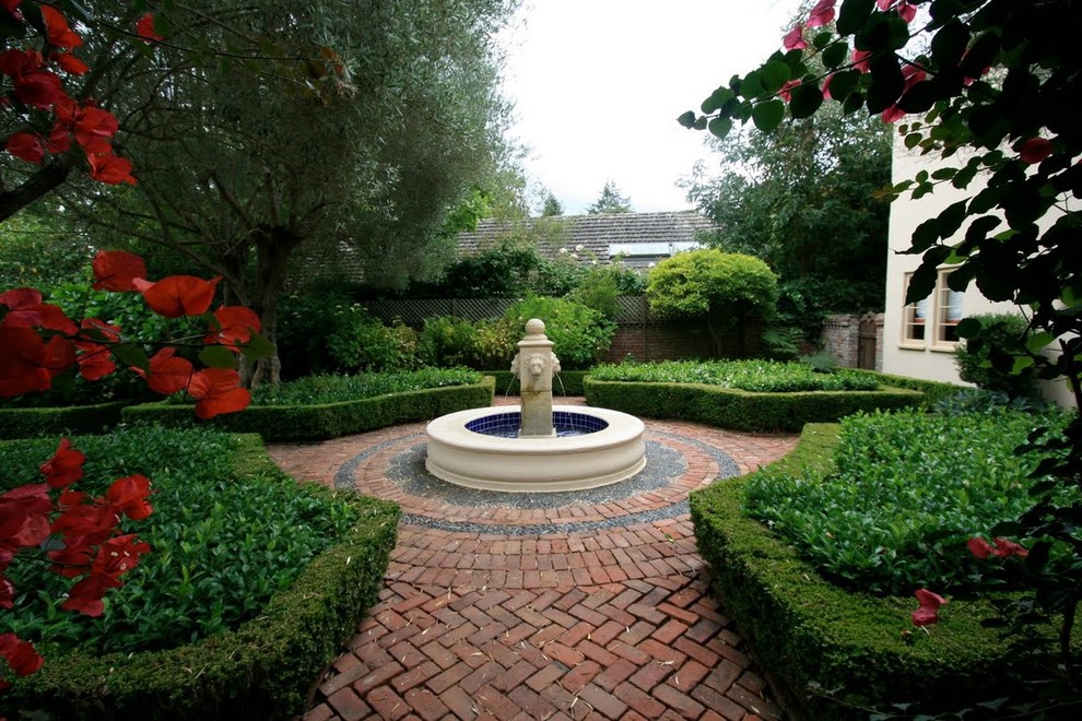 Design ideas for a mediterranean courtyard garden in Other with a water feature.