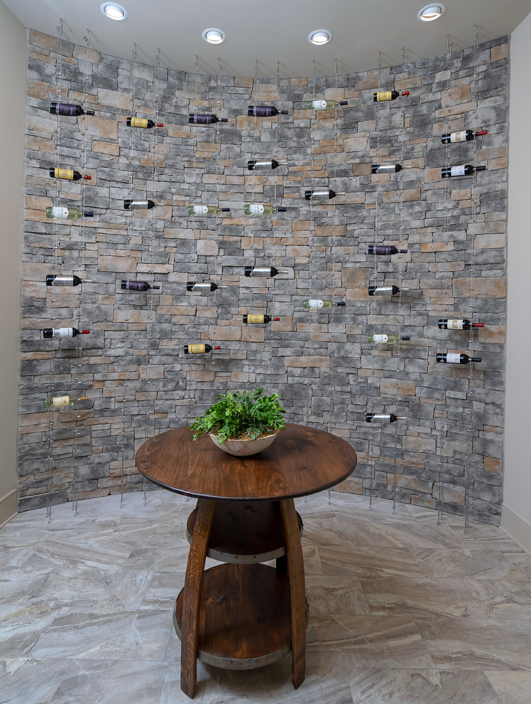 Photo of a small country wine cellar in Philadelphia with porcelain floors, storage racks and beige floor.