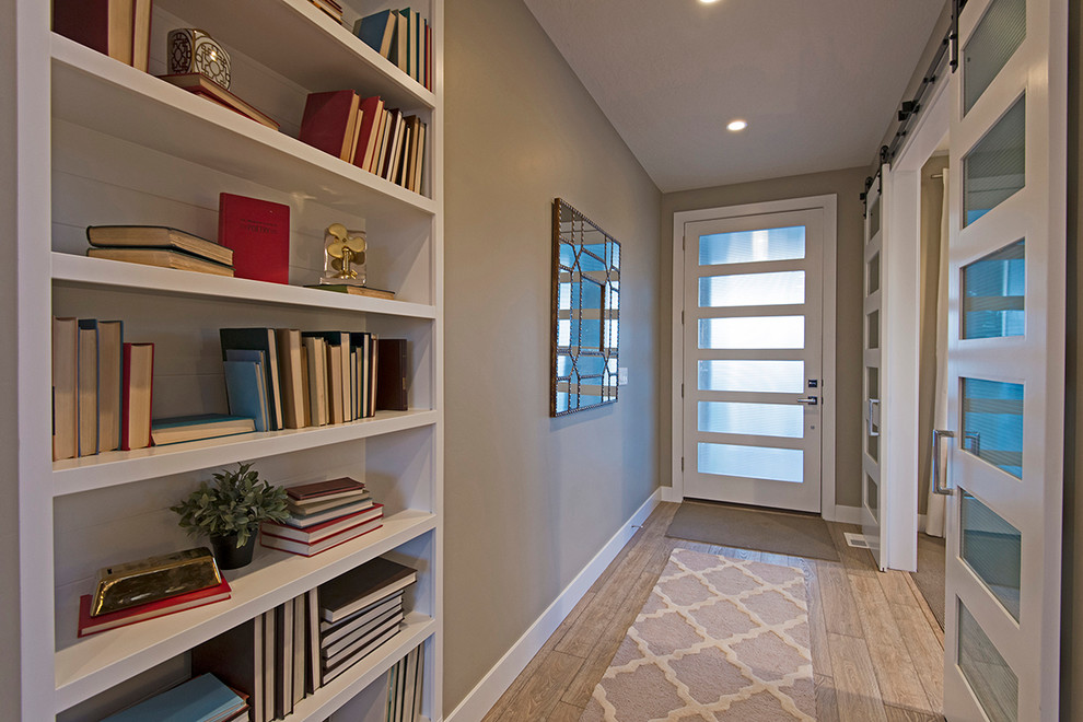 Inspiration for a contemporary entry hall in Salt Lake City with beige walls, laminate floors, a single front door and a white front door.